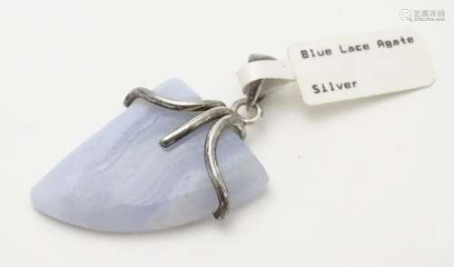 A silver mounted hardstone set pendant, the polished Blue Lace Agate formed as a stylised shark?s