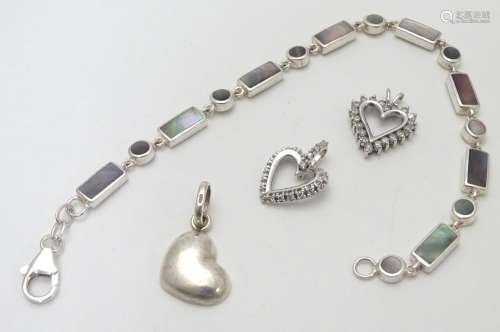 A silver bracelet set with abalone shell detail together with and 3 assorted charms (4) Please