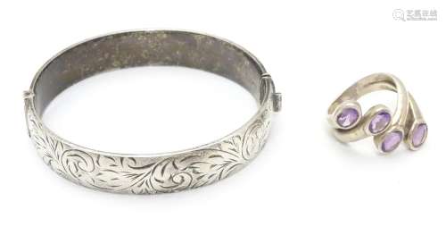 A silver bracelet of bangle form Hallmarked Birmingham 1974 together with a silver dress ring set