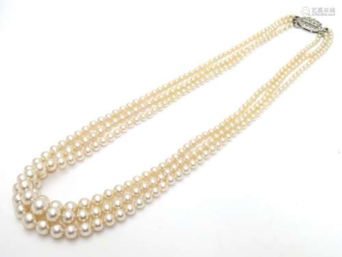 Vintage faux pearl three strand necklace by Rosita. Approx 15
