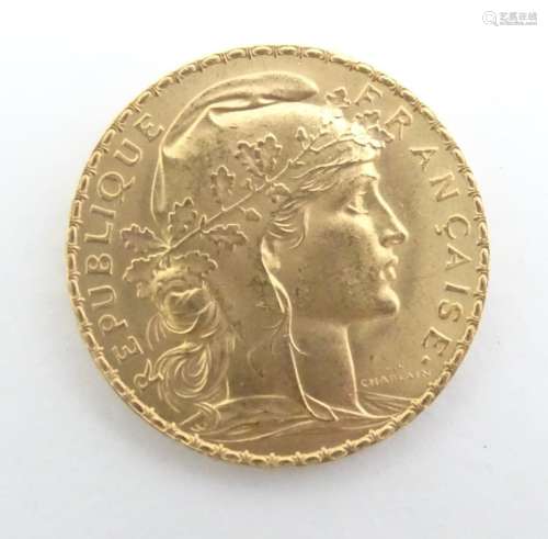 A French Republic 20 franc gold coin, 1914, approximately 6.5g Please Note - we do not make