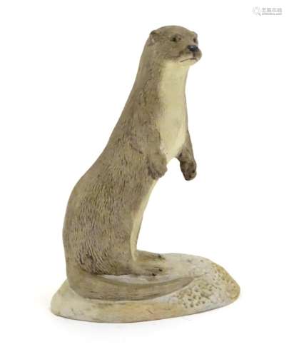 An Acorn pottery model of a standing otter. Signed P. Tunstall under. Approx. 3 3/4