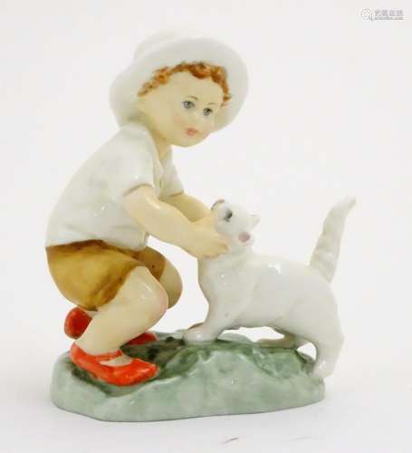 A Royal Worcester figure, Snowy, modelled as a child with a white cat . Marked under with title,