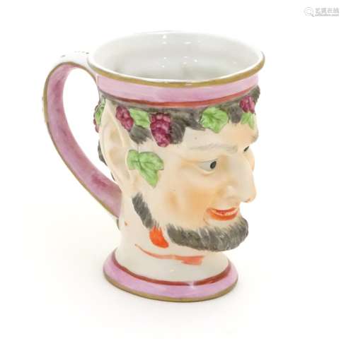 A Victorian Staffordshire character mug modeled as Bacchus. Approx. 4