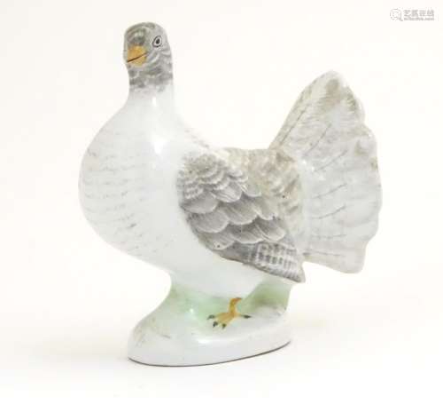 A porcelain model of a fantail pigeon. Approx. 4