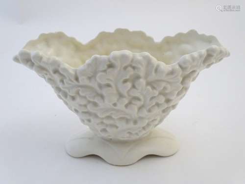 A Sylvac posy holder / vase, the body moulded with a leaf pattern in a white glaze. Approx. 6 1/4