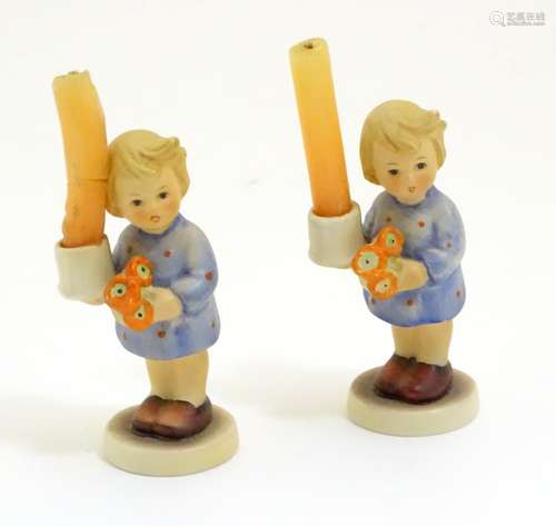 A pair of Vintage Hummel candle holders, girl with candle, model no. #115 impressed to base beside