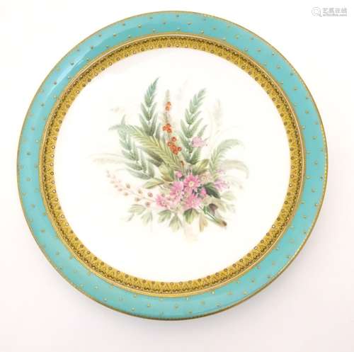 A Worcester dessert plate with hand painted floral and foliate spray to centre, bordered in