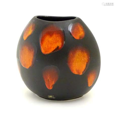 A Poole Pottery purse vase in the living glaze galaxy pattern. Marked under. Approx. 7