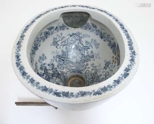 A Victorian water closet bowl / pan with blue and white transfer decoration depicting floral