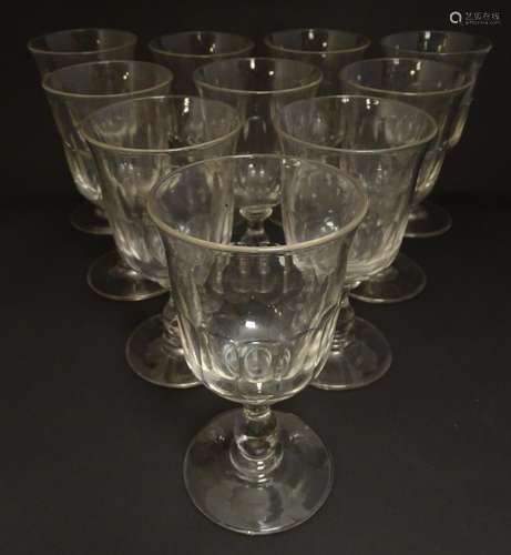 A set of 10 pedestal wine glasses with facet cut detail. 6