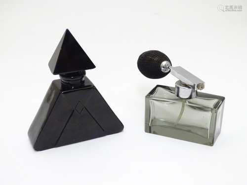 Two Art Deco glass scent bottles, one black glass formed as a pyramid, the other smoked glass with