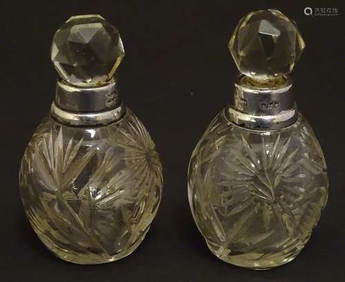 A pair cut glass scene / perfume bottles with silver collars . Hallmarked London 1911 maker Hart &