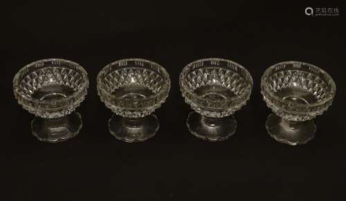 Four Victorian cut glass pedestal table salts, each 2 1/4