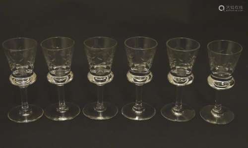 A set of six crystal sherry glasses formed as thistles, with cut roundel decoration, each 4 1/8