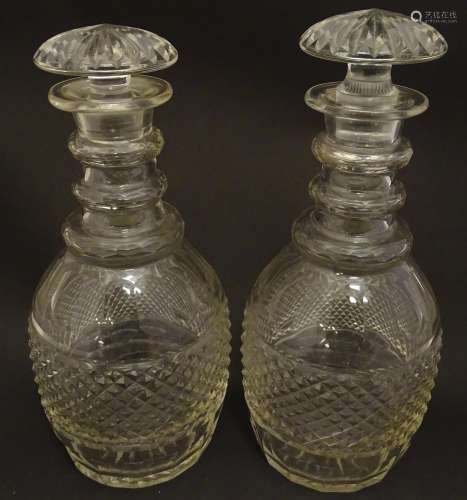 A pair of three ring cut glass decanter with hobnail banding. Approx 11 1/4