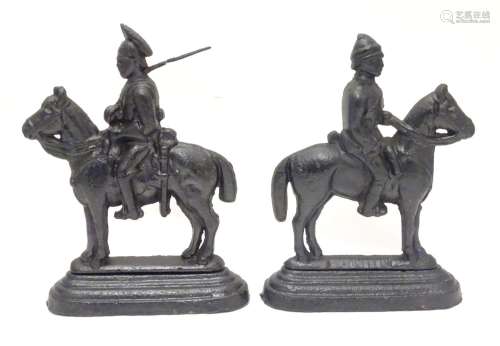 Two cast iron doorstops formed as military figures o horseback. Approx 10