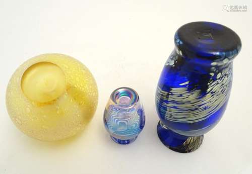 Three items of art glass, comprising a paperweight formed as an apple, and two vases. The largest