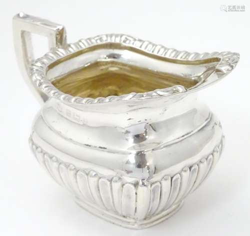 A silver cream jug, hallmarked Birmingham 1910, maker William Aitken. Approx. 2 3/4