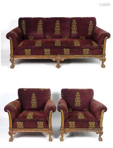 A Victorian three piece suite comprising a settee and two armchairs, having burgundy and gold