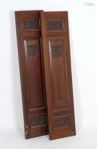 A pair of early 20thC mahogany panels with carved Art Nouveau decoration. 13