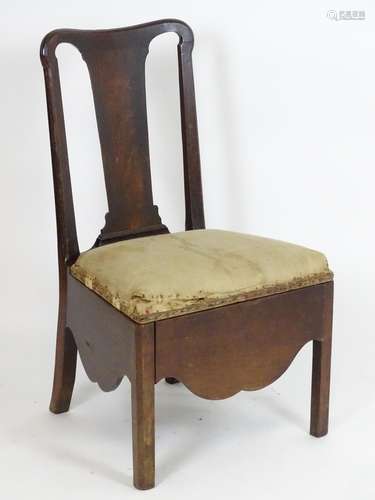 An 18thC mahogany side chair with a shaped top rail, vase shaped back splat and being raised on four