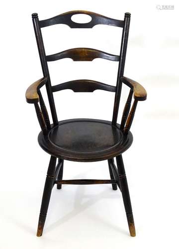 A mid 19thC Windsor chair with three shaped backrests, the top of these having a pierced handle, the