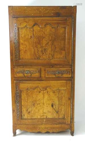 A mid 19thC walnut continental armoire with painted decoration, applied metalwork and having two