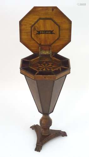 A 19thC sewing table with an octagonal top, parquetry decoration and fitted interior, having a