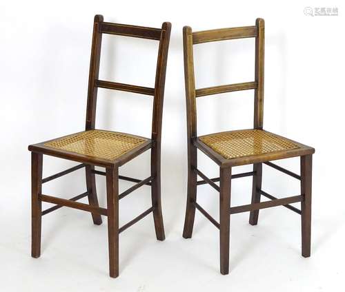 A pair of early 20thC side chairs with inlaid frames and caned seats above squared tapering legs.