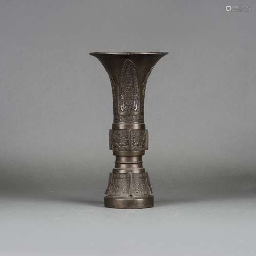 A CHINESE BRONZE BEAKER VASE