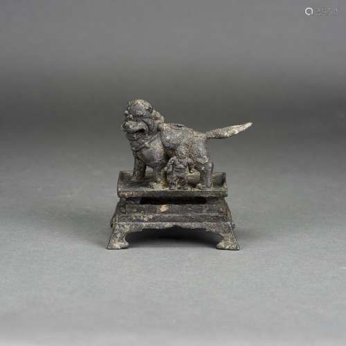 A CHINESE BRONZE MODEL OF A BUDDHIST LION