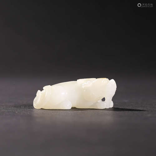 A  WHITE JADE ANIMAL WITH RUSSET