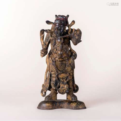 A GILT-BRONZE FIGURE OF QUAN GONG