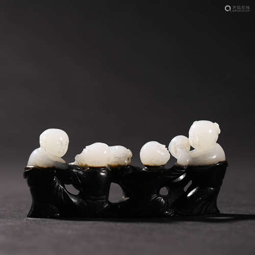 A BLACK AND WHITE JADE BRUSH REST