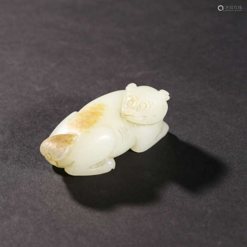 A WHITE JADE ANIMAL WITH RUSSET