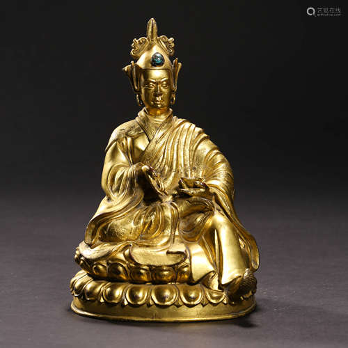 A  GILT-BRONZE PADMASAMBHAVA STATUE