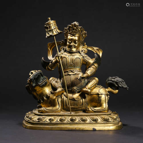 A  GILT-BRONZE KING OF WEALTH STATUE