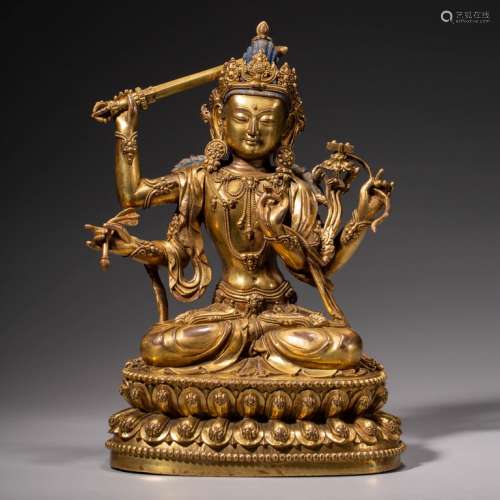 A Gild Bronze Statue of  Four Arms Guanyin