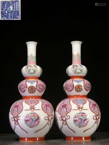 Backflow. A Pair of  Famille Rose Gourd-shaped Vases with  Hand-painted Flowers and Qianlong Reign Mark , the Republic of China