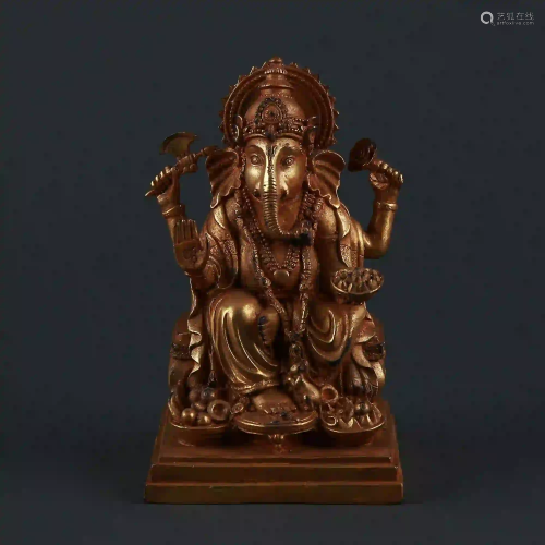 A gilt bronze elephant trunk statue of the god of
