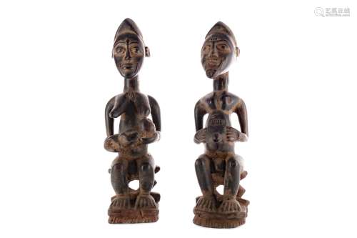 A PAIR OF BAULE IVORY COAST WOOD FERTILITY FIGURES