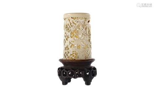 AN EARLY 20TH CENTURY CHINESE CARVED AND PIERCED IVORY VASE