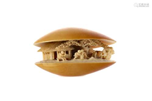AN EARLY 20TH CENTURY CHINESE IVORY CLAM SHELL CARVING