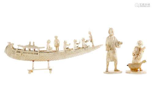 AN EARLY 20TH CENTURY INDIAN IVORY CARVING OF A BOAT AND TWO FIGURES