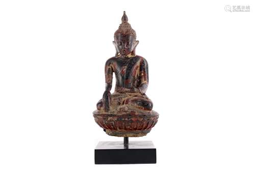 AN EASTERN PAINTED STONEWARE BUDDHA