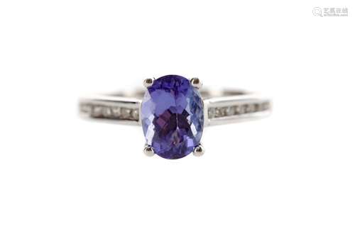 A TANZANITE AND DIAMOND RING