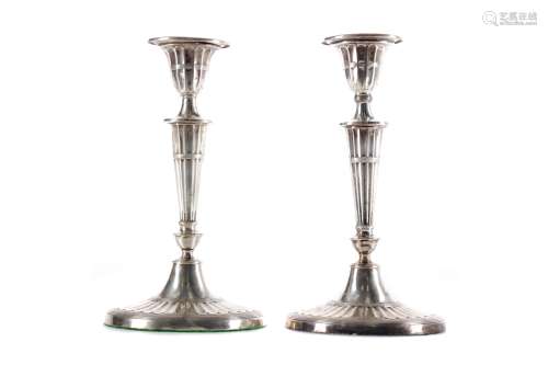 A PAIR OF NEO-CLASSICAL SILVER CANDLESTICKS