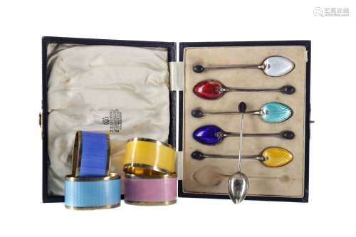 A SET OF SILVER AND ENAMEL NAPKIN RINGS AND COFFEE SPOONS