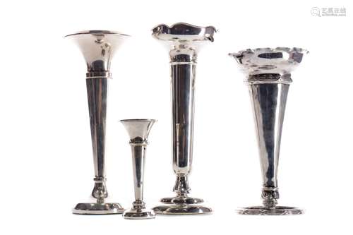 A EDWARDIAN SILVER TRUMPET VASE AND THREE OTHERS